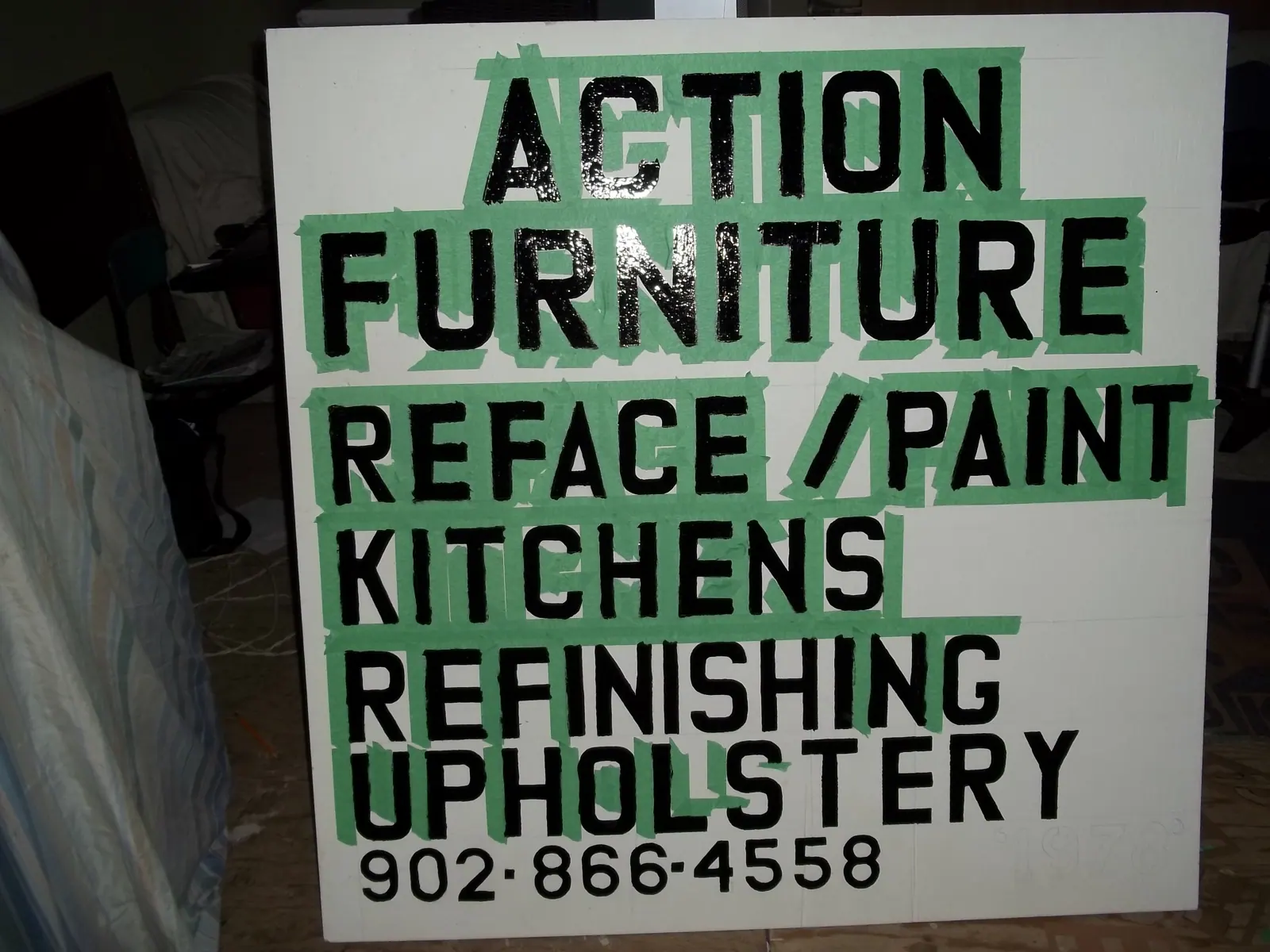 Hand-painted Action Furniture shop sign